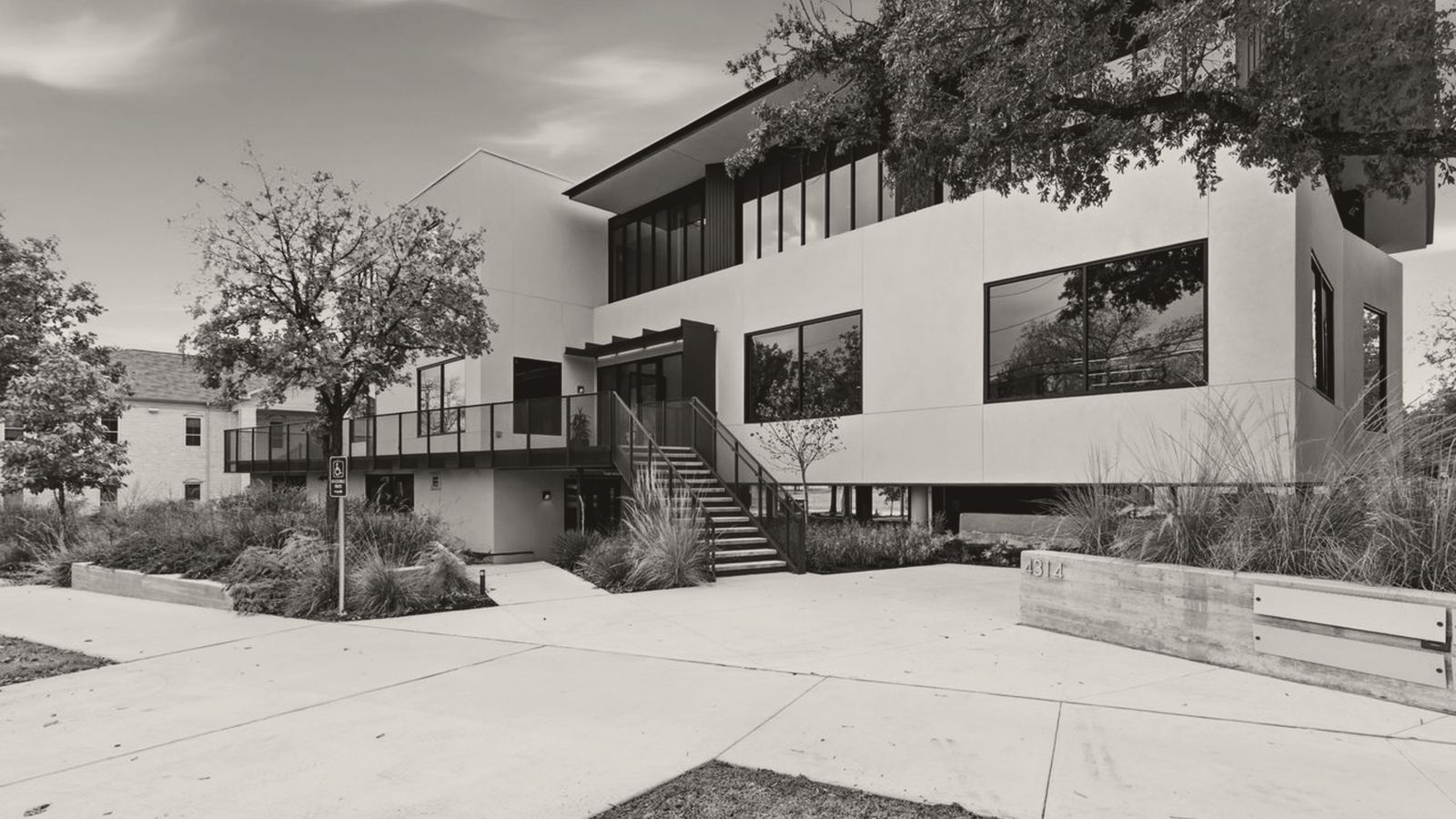 Two-story office building with landscaped entry